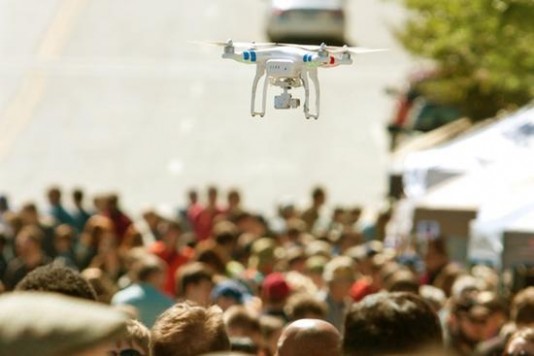flying-drone-hovers-over-crowd-at-fair-640x0